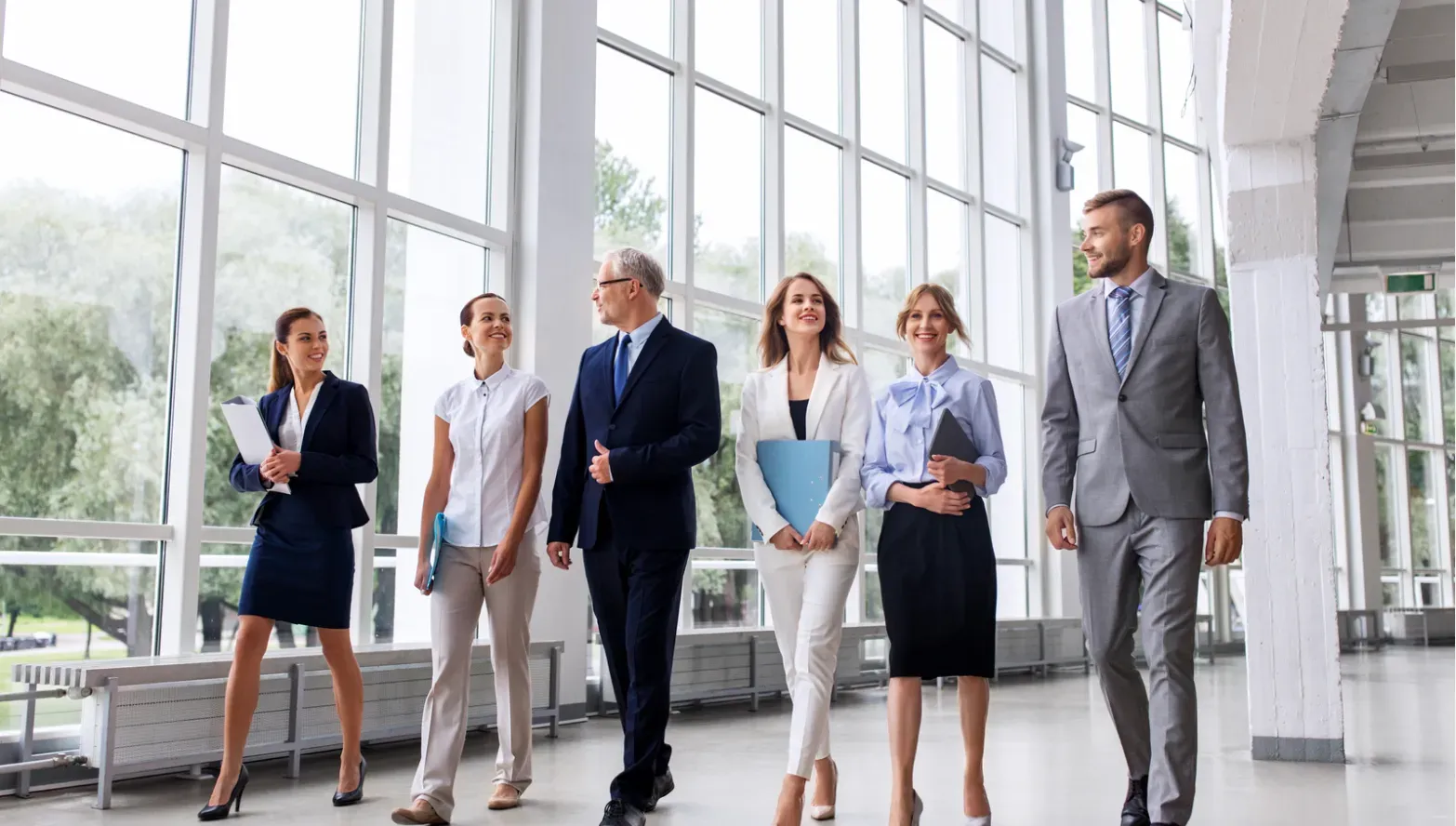 Executives walking in the office lobby